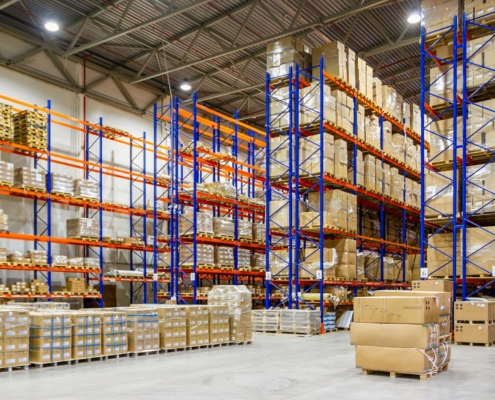 Interior Of A Modern Warehouse Storage Of Retail Shop With Pallet Truck